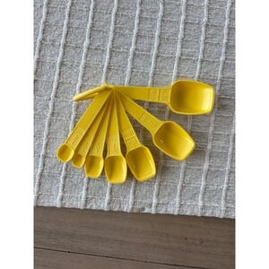Vintage yellow Tupperware set of measuring spoons